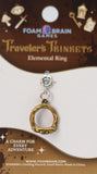 Gold ring charm on a Foam Brain Games branded card