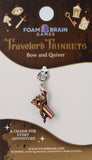 Charm for travelers on a Foam Brain Games card with decorative elements.