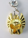 Gold cat-shaped pendant on a white background