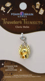 Gold cleric helmet charm on a Foam Brain Games card