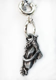 Silver charm shaped like a cat on a white background