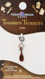 Lute charm on a Foam Brain Games packaging with decorative elements.