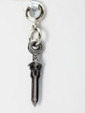 Silver key-shaped pendant on a white background