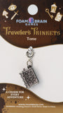 Charm for every adventure on a Foam Brain Games branded card