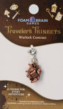 Copper charm on a Foam Brain Games branded card