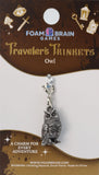Owl charm on a Foam Brain Games card with branding and product details.