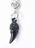 Black tooth-shaped charm on a white background