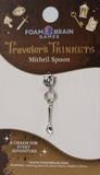 Mithril spoon charm on Foam Brain Games packaging