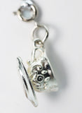 Silver earring with a detailed design on a light gray background