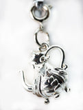 Silver charm shaped like a cat on a white background