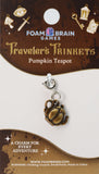 Pumpkin teapot charm on Foam Brain Games packaging