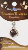 Foam Brain Games wooden stein charm on a display card with branding and product details.