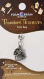 Coin bag charm on a Foam Brain Games branded card with decorative elements.