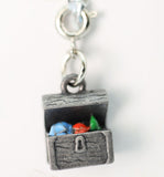 Silver charm resembling a jewelry box with colorful stones on a white background