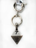 Silver keychain with a triangular charm featuring the numbers 7 and 8 on a white background