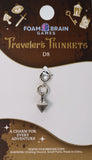 Silver charm on a Foam Brain Games branded card with decorative elements.
