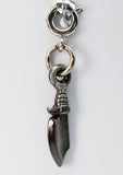 Silver knife charm on a white background