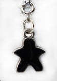 Black star-shaped charm on a white background