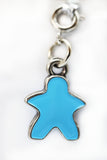 Blue star-shaped charm on a white background