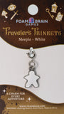 White meeple charm on a Foam Brain Games card with decorative elements.