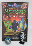 Lost Tome of Monsters Volume 2 Mystery Loot packaging with game figures and dice on a white background