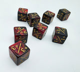 Set of polyhedral dice with red and black colors and gold numbering on a white background