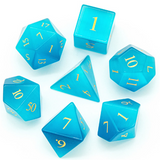 Set of blue polyhedral dice with yellow numbers on a white background