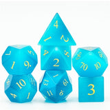 Set of blue polyhedral dice with yellow numbers on a white background