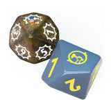 Two dice, one brown with white numbers and the other blue with yellow symbols, on a white background.