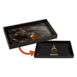 Black decorative tray with a dragon design on one side and a geometric symbol on the other, with an orange arrow indicating a transformation.
