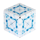 A cube-shaped folding box or container with a white base and an abstract blue marbled or watercolor-like pattern, shown on a plain white background.
