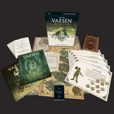 Vaeesen tabletop game starter set with books, cards, and dice on a dark background