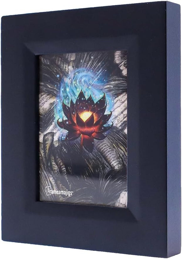 Black framed picture with a colorful abstract design inside