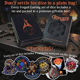 Forged Gaming dice set with tin, box, and stickers on a rustic background