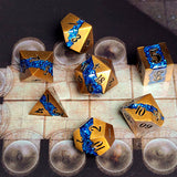 Gold and blue polyhedral dice set on a map background