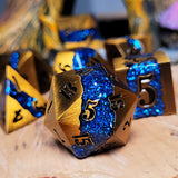 Gold and blue dice set on a wooden surface