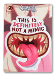 Sticker with a mouth design and text 'This is definitely not a mimic' on a pink background.