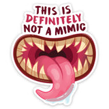 Sticker with a mouth graphic and text 'THIS IS DEFINITELY NOT A MIMIC' on a white background
