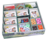 Card game box with various cards and pieces on a white background