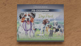 Packaging of 'Dog Park' with illustrations of dogs on a wooden surface