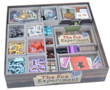Board game box titled 'The Fox Experiment' with various compartments containing game pieces and cards.