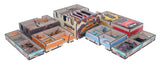 Collection of card game boxes with various designs on a white background