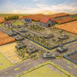Model military scene with tanks and soldiers on a battlefield layout.