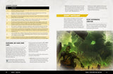 Open book showing a gaming rulebook with desert wasteland illustration and text.