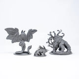 Three gray fantasy figurines on a white background