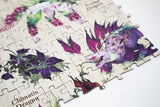Jigsaw puzzle with floral and dragon design on a white background