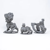 Three gray fantasy creature figurines on a white background