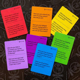 Colorful cards with questions on a dark background