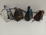 Four decorative headbands with unique designs on a white background