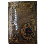 Decorative book with intricate gold designs on a white background